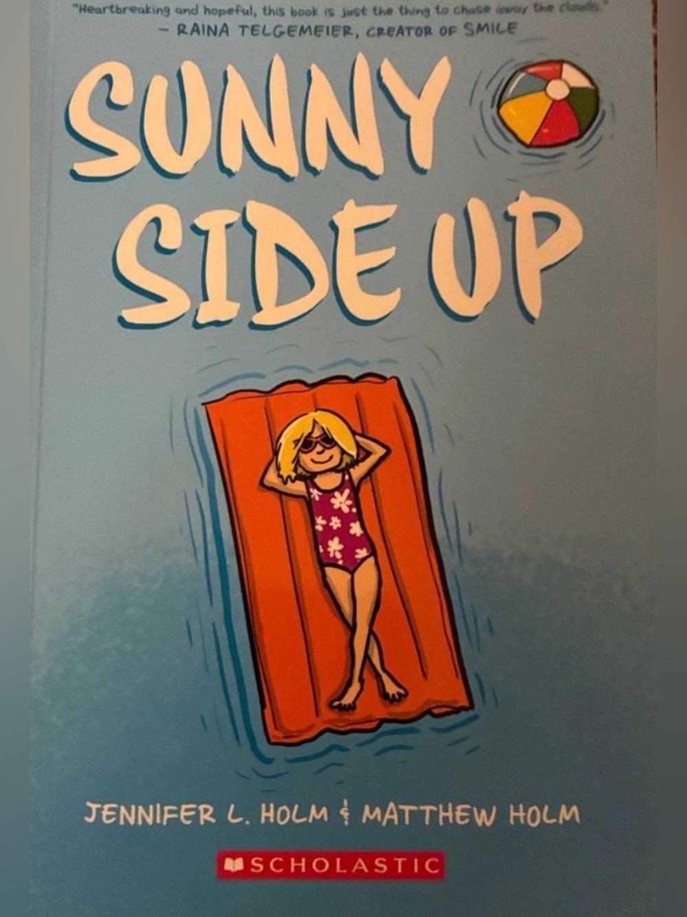 Scholastic Sunny Side Up — Blue Cover with Orange Float